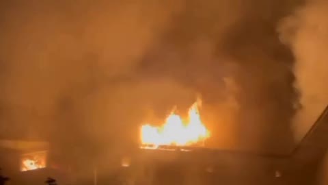 Footage of a fire on Leninsky Prospekt in Moscow, where a residential high-rise building is burning