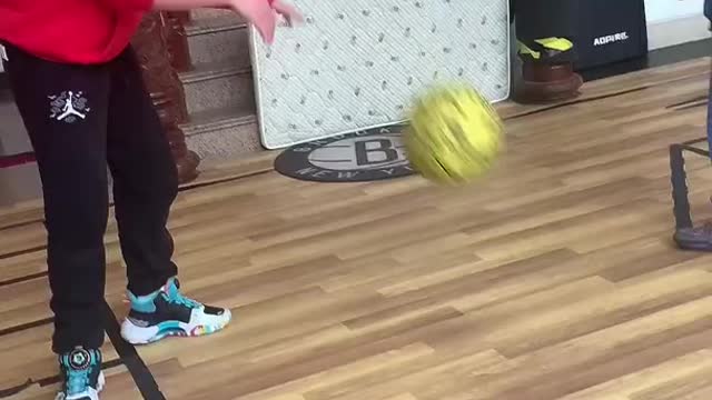 sister and brother playing basketball