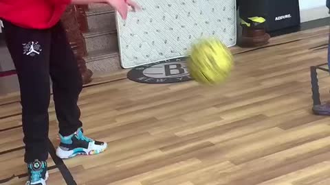 sister and brother playing basketball