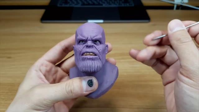 Use Black Clay To Paint Pupils On The Figure