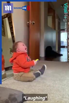 Baby laughs at mom exercising