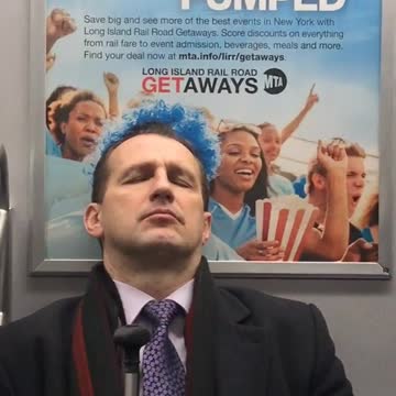 Man with blue hair suit cane