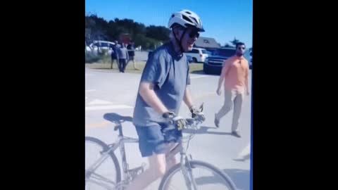 Biden falling off his bike and crapping himself