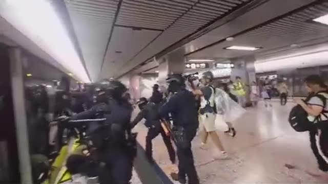 Chinese Government Stormtroopers Besiege Subway Train as They Beat & Spray Peaceful Citizens