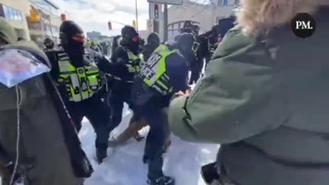 Trudeau's Goons Attack Female Protester - Club Her On The Ground