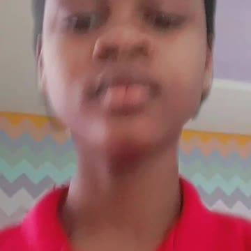 Keziah is doing homework in her clean house