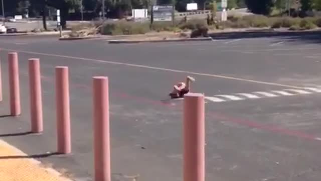 Little boy in red orange hat falls