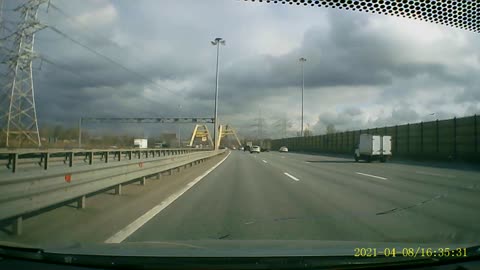 Driver Narrowly Avoids Overturned Semi Entering Highway