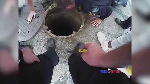 Bodycam Shows Cops Rescuing Dog from Sewer Drain
