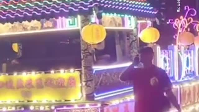 Serangoon Taoist processior has sports cars & LED floats