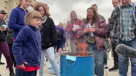 Iowa Protesters Burn Masks In Front Of State Capitol