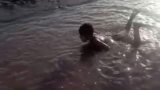 Kids playing in river