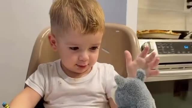 Father joking with his little boy