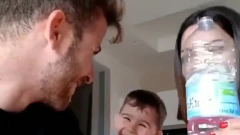 Son loves & laugh at parents magic trick