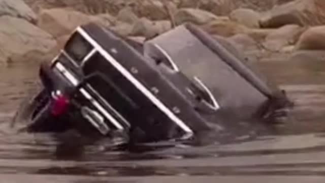 Dangerous river crossing by car...