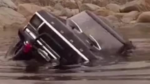 Dangerous river crossing by car...