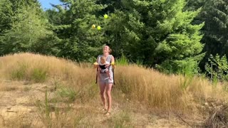 Mom Juggles 5 Balls While Holding Baby