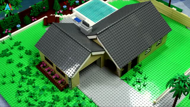 Lego houses have gardens and swimming pools