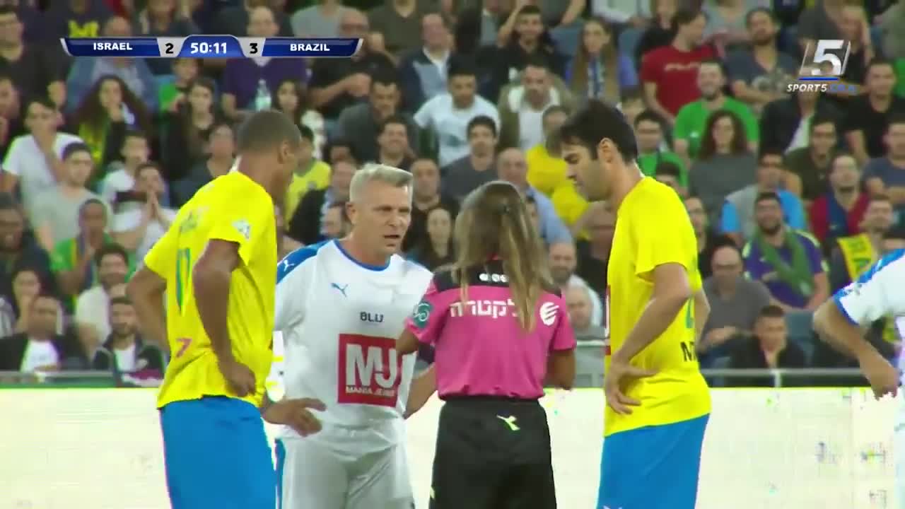 Cute referee takes selfie with soccer players