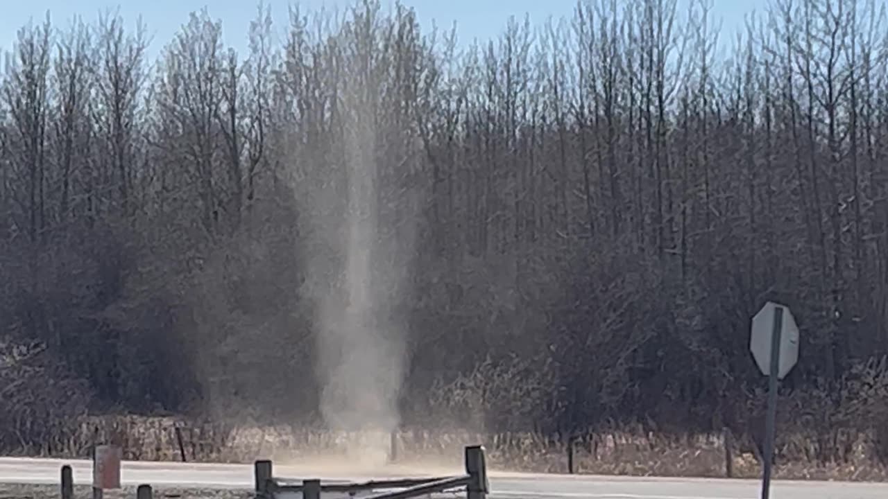 Dust Devil Rises High Into the Sky