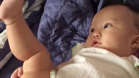 Baby talking to his feet