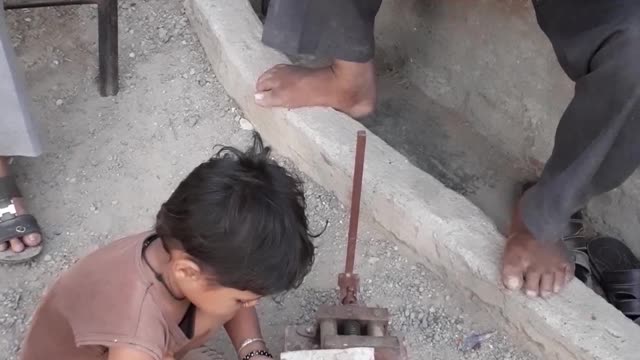 Cute little boy try to hard hammer