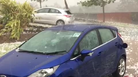 Surprise Hail Storm Smashes Car in Seconds