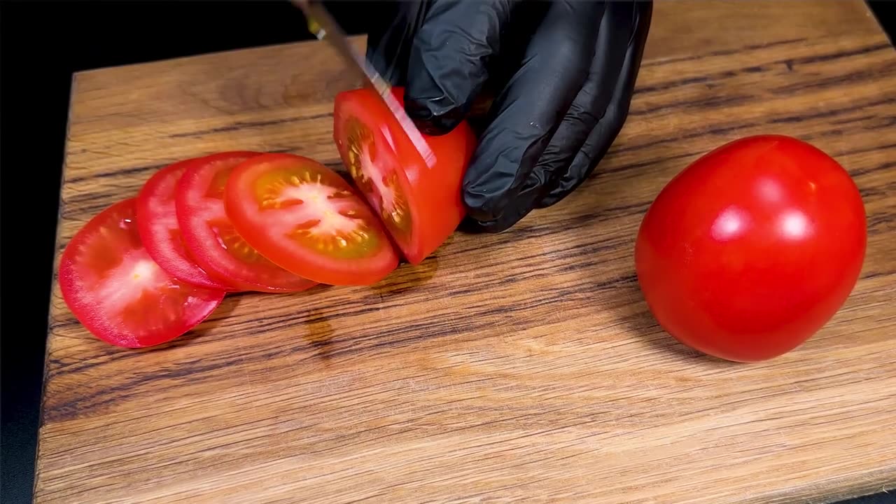 Juicy chicken breast with tomatoes and cheese in the oven