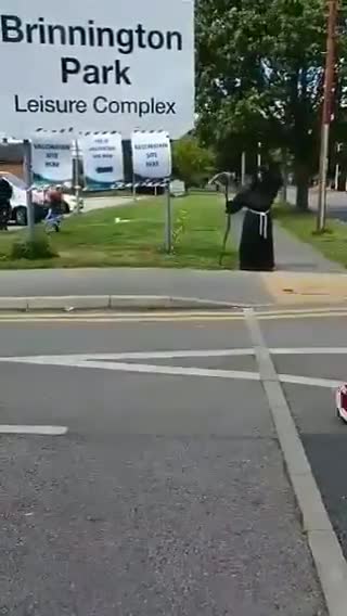 Grim reaper spotted outside jab center