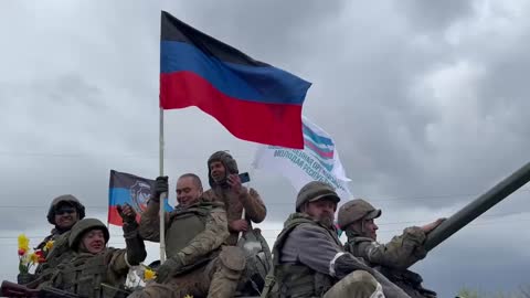 Greeted with flowers and flags at Donetsk