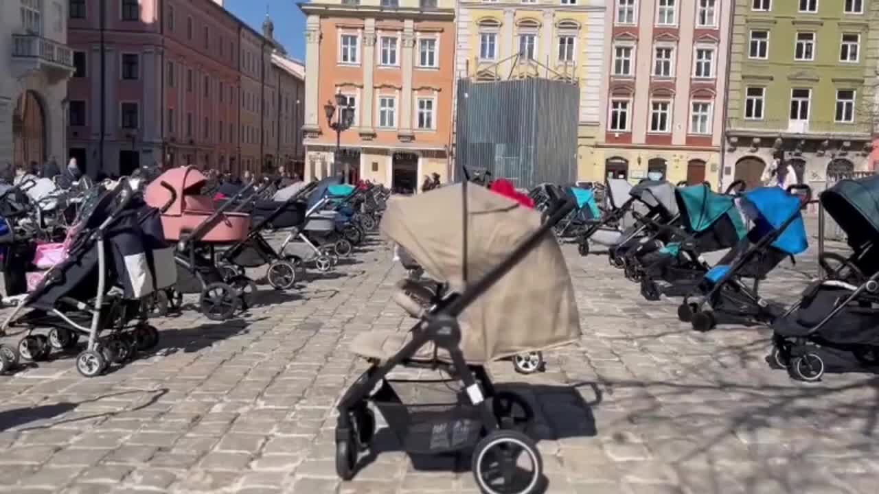 Ukrainians leave strollers in central Lviv to remember children killed in Russia