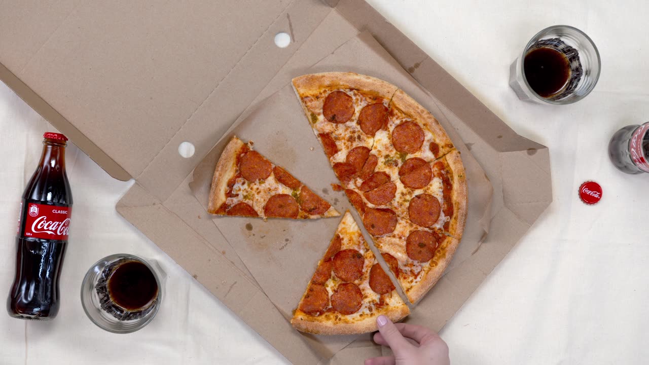 The famous and delicious American pizza with Coca-Cola