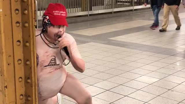 Man naked suit red hat screaming on subway station