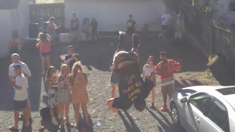 Camo pants . black shirt success roof backflip