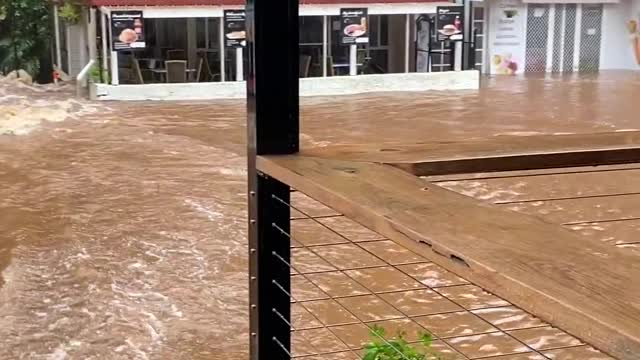 Floods Turn Creek Into Raging Torrent