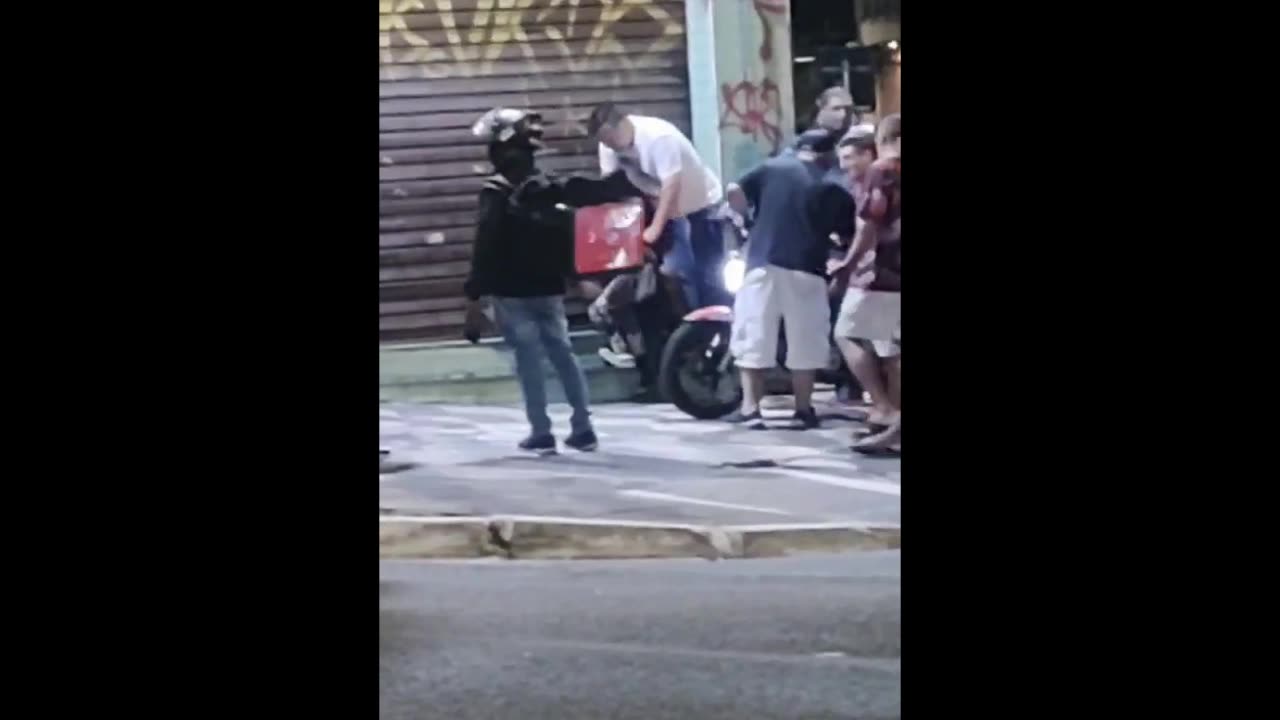 Captured Phone Snatcher Punched By Angry Man