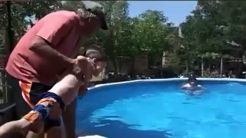 Funny man falls in the pool