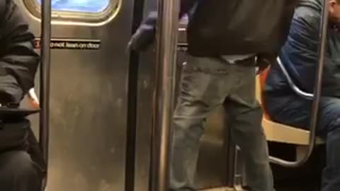 Guy dances by himself in subway train