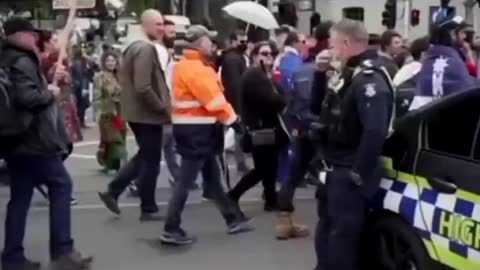 An Officer consoled by a rally attendee. Long Live Freedom