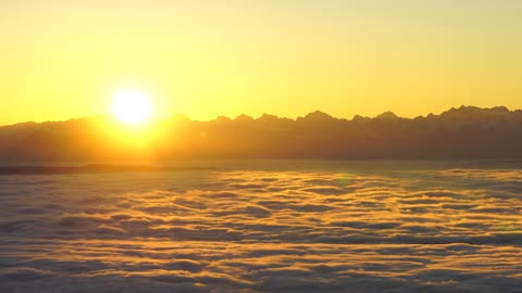 Above The Clouds - 4K - Sunrise Over The Alps