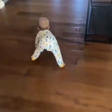 Fleshe's son learning to crawl