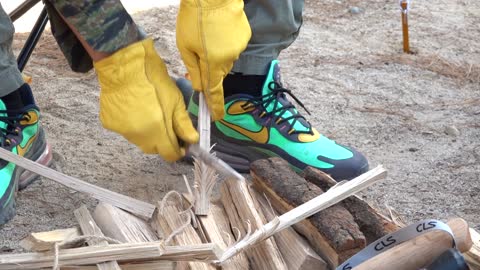 Wooden firewood is being cut.