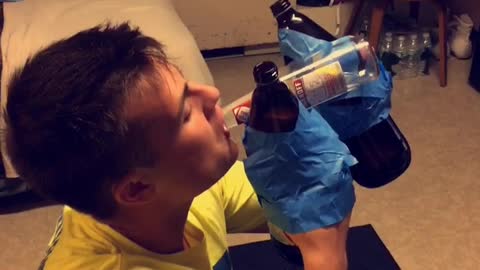 Guy with taped beers on hands drinking