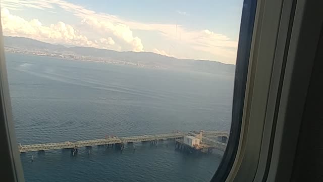 Scenery video from outside the window when the plane takes off.