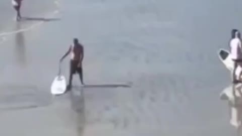 Surfers Fight On Beach