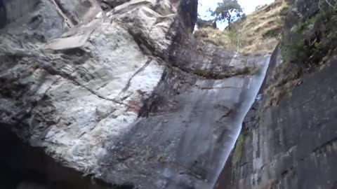 Beautiful mountain cave and water fall