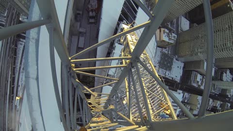 Daredevil Climbs Icy Crane