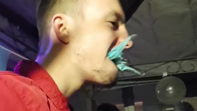 Man eats plastic banner