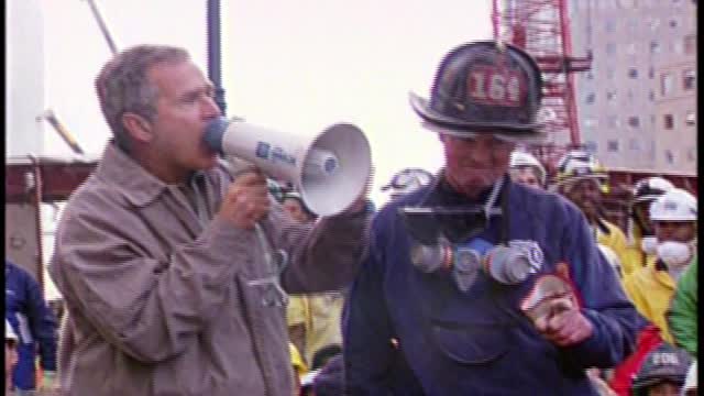 Bush's iconic Ground Zero speech atop of rubble alongside firemen