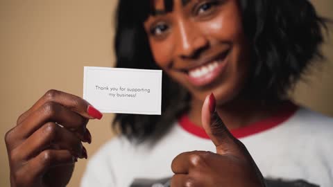 Woman Holding a Card
